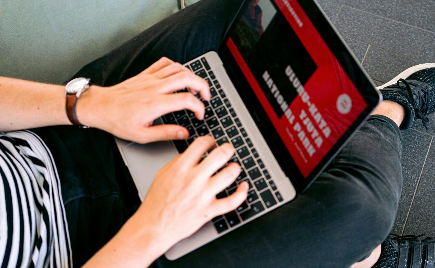 Man Creating a Presentation on Laptop